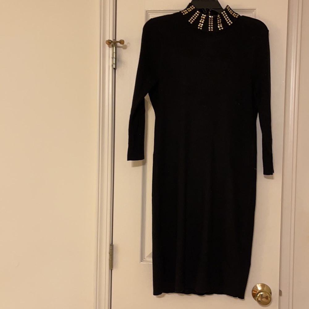 Brand: Calvin Klein Color: Black with Gold embellishments Size: Medium